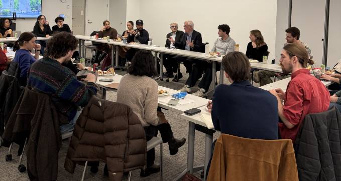 people sitting around rectangular table